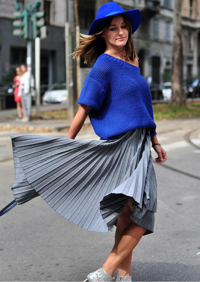Full skirts, pleats and bright colours take over street style